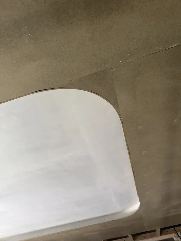 Close view of a plastered curved ceiling edge
