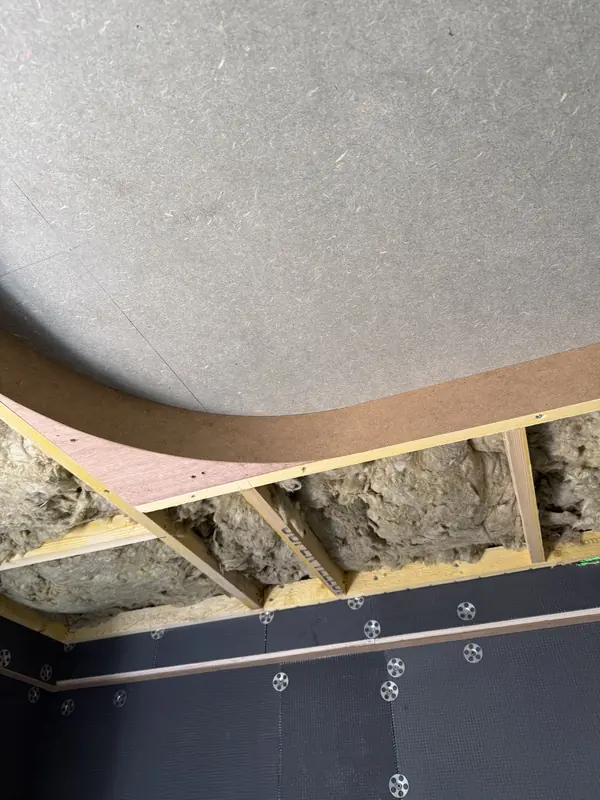 Curved plywood edge former where the ceiling meets the coffer
