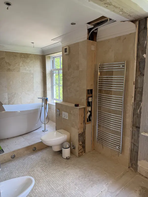 The original travertine bathroom before the works began