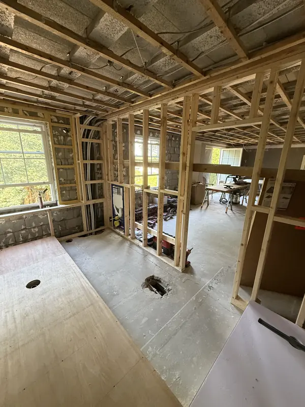 New timber stud partitions framing the en-suite, looking through to the bedroom