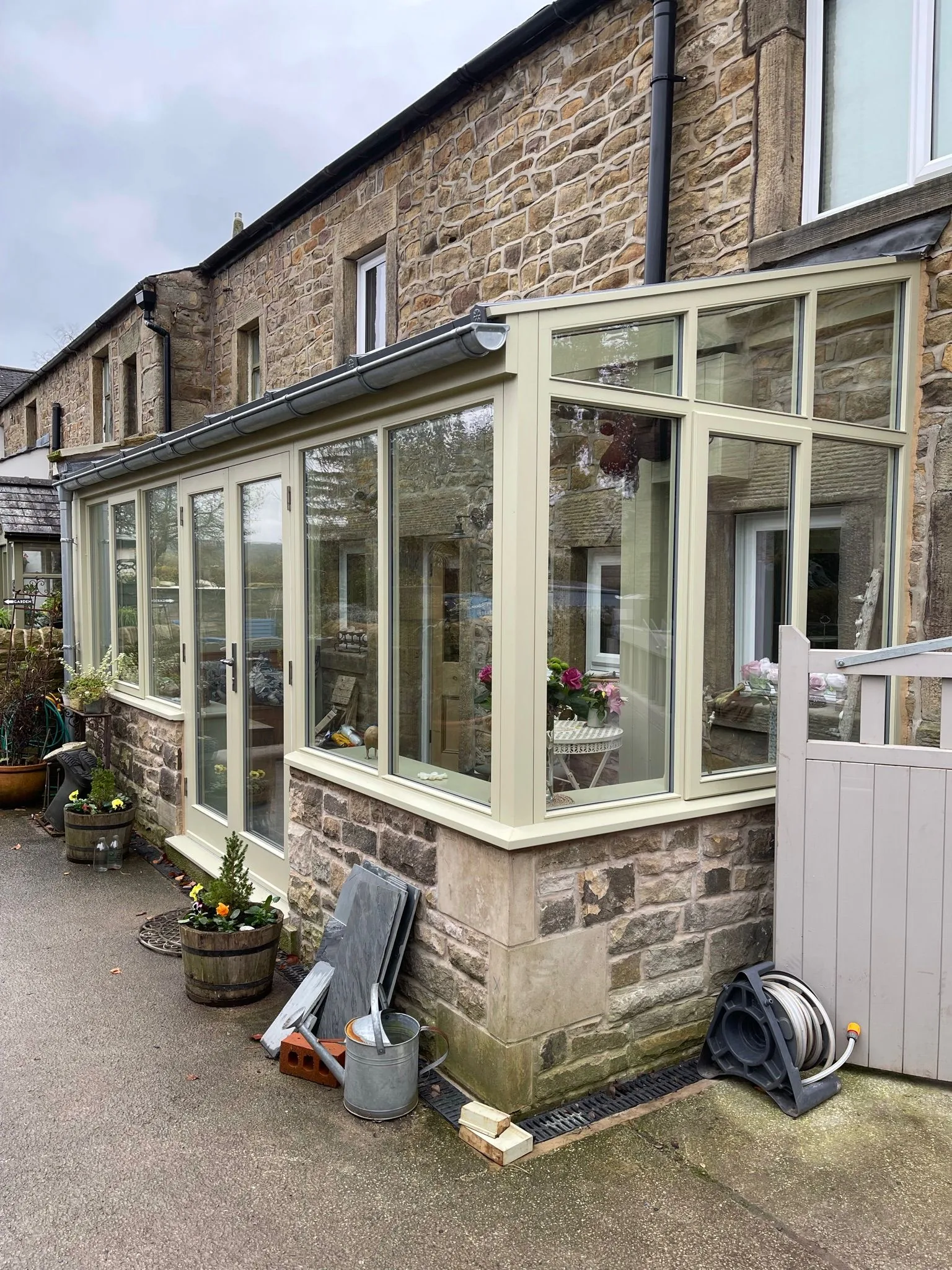 Bespoke cream-painted timber sunroom on a traditional Lancashire stone cottage
