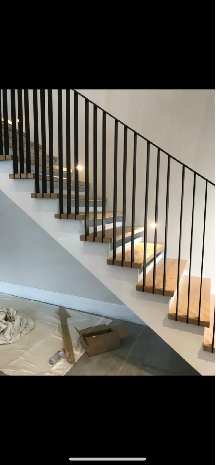Bespoke floating oak treads with slim black metal balustrade