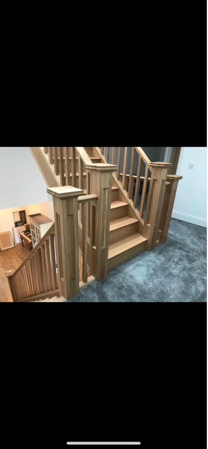 Bespoke solid oak staircase with square newel posts and traditional spindles